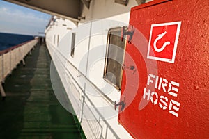 Red fire hose on a ship