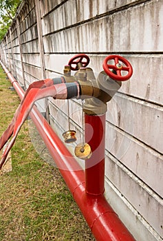 Red fire hose. Water pipes around the fence around the factory. In the event of a fire occurs, fire hose can be used immediately.