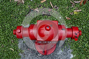 Red fire hydrant in a city street for firefighters, Singapore