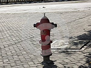 Red Fire Hydrant on Paved Sidewalk