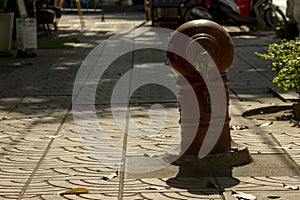 Red fire hydrant on the sidewalk.