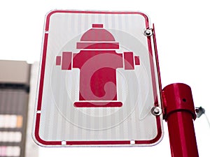 Red Fire hydrant sign on a street