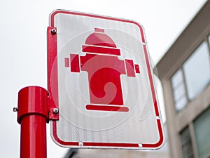 Red Fire hydrant sign on a street