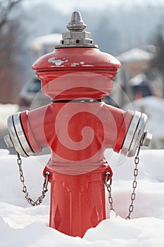 Red fire hydrant on the street. Fireplug in the snow