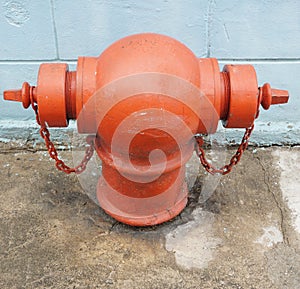 Red Fire Hydrant beside wall