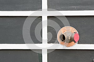 Red fire hydrant on wall