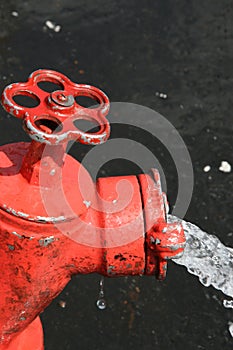 Red fire hydrant and water
