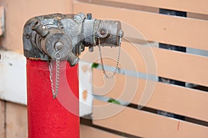 Red fire hydrant water pipe with a chain