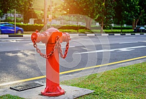 Red fire hydrant water pipe near the road.