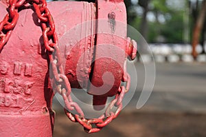 Red fire sprinkler on roadside