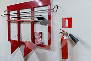 Red fire stand with fire extinguishing tools