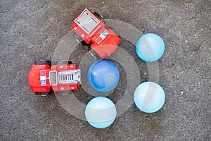 Red fire truck and blue plastic ball