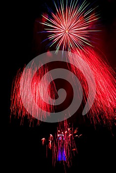 Red fireworks in Ostrava with city hall clock