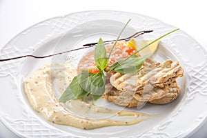 red fish and caviar tartare served on a plate