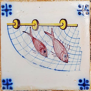 Red fish on net antique tile