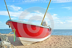 Red fishing boat on the beach