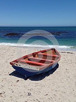 Red fishing boat beached in Lamberts Bay