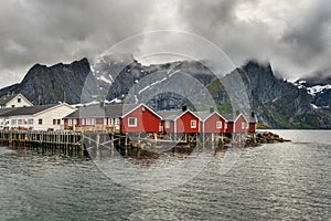 Red fishing cabins in Hamnoy, Norway photo