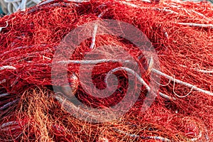Red fishing nets with floats and ropes. Still-life shot, perfect image for fishing, aquaculture, intensive fishing and