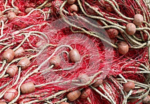 red fishing nets with floats used to fish