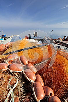 Red fishnet and fisherman tools