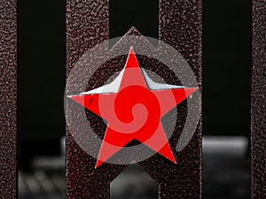 The red five-pointed metal star is a symbol of the Soviet Union and the Soviet Army, a close-up Soviet star