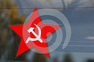 Red five-pointed star with sickle and hammer emblem