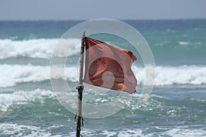 Red flag danger during a storm on the ocean
