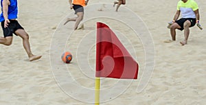 Red flag signaling a corner of a beach soccer field