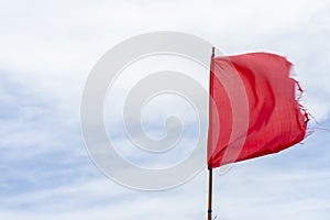 Red flag warning flags wind blue sky