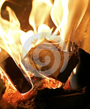 Red flame quickly burning wood photo