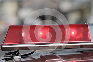 Red flashing sirens of police car during driving