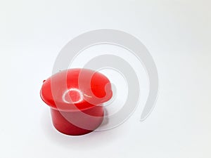 red fliptop type plastic bottle cap, isolated on white background
