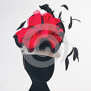 Red flower and black feathers races hat