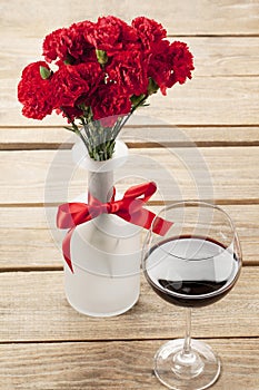 Red flower and wine decorated on table