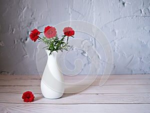 Red flowers in vase on table still life flowers for background or wallpaper ,red moss rose purslane portulaca grandiflora ,text me