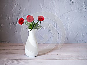 Red flowers in vase on table still life flowers for background or wallpaper ,red moss rose purslane portulaca grandiflora ,text me