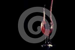 Red fluid puring in to the wine glass