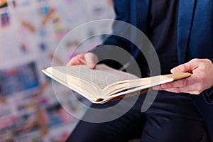 Getting information. Reading folder, folder on the chair.