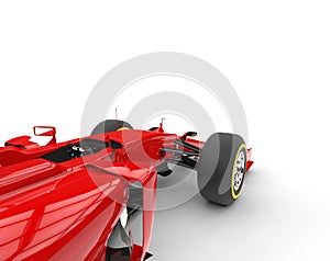 Red formula one car - focus on front wheels