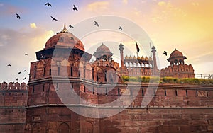 Red Fort Delhi medieval red sandstone fort at sunset with moody sky