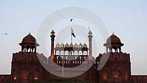 red fort's lahori gate floodlit at dusk in delhi, india