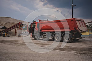 Red four axle dumptruck