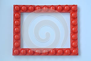 Red frame made of hildrens designer for the development of motor skills and imagination