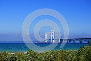 Red Freighter Under the Mighty Mackinac Bridge