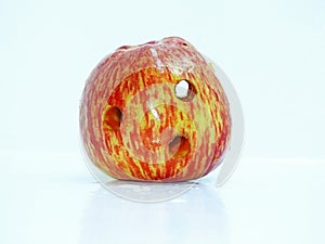 Red fresh apple with holes