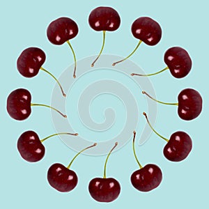 Red fresh cherry fruit background, frame and border, empty space