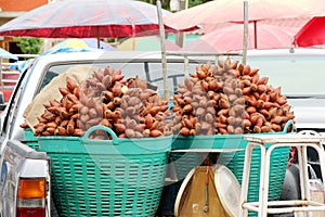 Red fresh salacca, zalacca, salak fruit in basket.