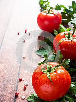 Red Fresh Tomatoes Parsley Pepper on wooden background Copy space Selective focus