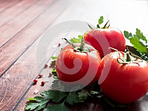 Red Fresh Tomatoes Parsley Pepper on wooden background Copy space Selective focus